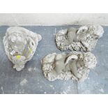 Stonework - three reconstituted stone cherubs,
