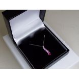 A 9 carat white gold pink sapphire drop pendant, (unused surplus retail stock) approx weight 1.