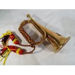 A brass bugle. Estimate £30 - £50