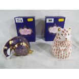 Royal Crown Derby - two paperweights by Royal Crown Derby depicting a badger and a hamster,