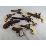 Six Replica Flintlock pocket pistols and a Replica Derringer type double barreled pocket pistol