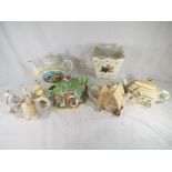 A collection of five ceramic novelty teapots to include The Pooh Pantry Teapot by Lenox,