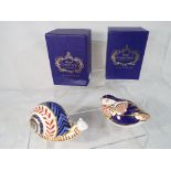 Royal Crown Derby - two paperweights depicting a Snail and a Quail,