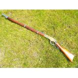 A replica Henry underlever repeating rifle with working action