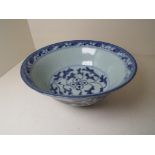 Asian Arts - an early Chinese pedestal bowl decorated in a blue and white floral / foliate pattern