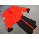 A military uniform comprising a red dress jacket with corporal stripes by Costello of London and