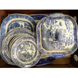 A large quantity blue and white "Willow Pattern" dinnerware.