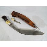 A bone and ebony handled Kukri and a small bone handled knife in scabbard overall size of blade