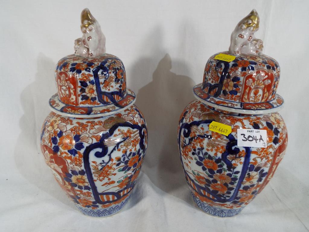 A pair of Imari vases with lids circa 1890,