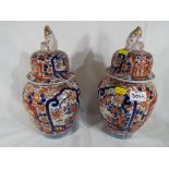 A pair of Imari vases with lids circa 1890,