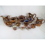A quantity of antique copper lustre pottery.