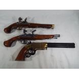 Two Replica Flintlock pistols and a Replica rare Volcanic repeating under lever pistol