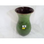 An antique green glazed stoneware vase, approximately 32 cm (h).