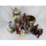 A good lot to include a Japanese vase, 3 tribal figurines, a Lladro figurine,