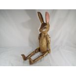 A wooden jointed rabbit,