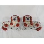 A pair of Staffordshire brown and white dogs Est £15- £25