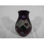 Moorcroft Pottery - a Moorcroft Pottery vase decorated in the Rennie Rose pattern, 7.