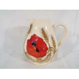 Moorcroft Pottery - a Moorcroft Pottery jug decorated in the Harvest Poppy design, 15.