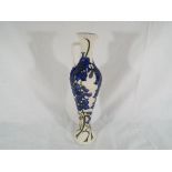 Moorcroft - a Moorcroft jug decorated in the Delphinium pattern, approximate height 32 cm (h).
