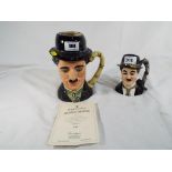 Royal Doulton - two Royal Doulton character jugs depicting Charlie Chaplin D6949,
