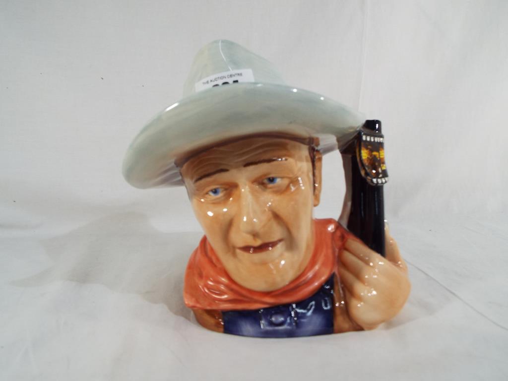 Royal Doulton - a Royal Doulton character jug depicting John Wayne, 2007 Character Jug of the Year,