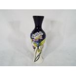 Moorcroft Pottery - a Moorcroft pottery vase decorated in the Trefoil design, 20.