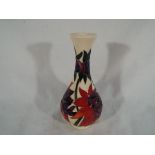 Moorcroft Pottery - a Moorcroft Pottery vase in the Ruby Red pattern, 15.