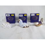 Royal Crown Derby - three paperweights by Royal Crown Derby depicting a wren,