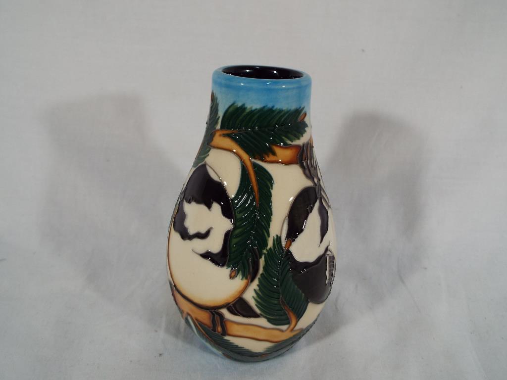 Moorcroft Pottery - a Moorcroft Pottery vase decorated with the RSPB Coal Tits design, 12.