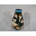 Moorcroft Pottery - a Moorcroft Pottery vase decorated with the RSPB Coal Tits design, 12.