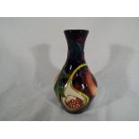 Moorcroft Pottery - a Moorcroft Pottery vase decorated in the Queens Choice design, 12.