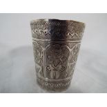 An Indian silver highly carved beaker,