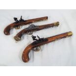 Three replica pistols to include two flintlock and one percussion pistol