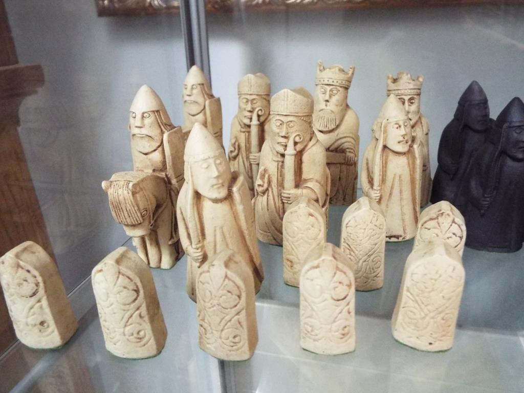 A set of Isle of Lewis chess pieces made from carved saop stone. - Image 3 of 4