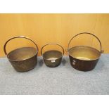 Three antique brass jam pans.