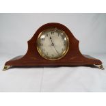 An early 20th century mahogany cased mantel clock, French movement, Arabic numerals on a white dial,