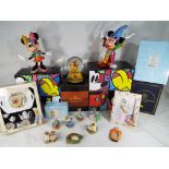 Two Disney figurines depicting Mickey Mouse and Minnie Mouse by Britto,