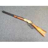 A replica Winchester underlever rifle with moving underlever action