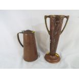 An Arts and Crafts copper embossed two-handled vase,