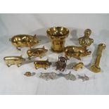 A collection of assorted brassware to include pigs,