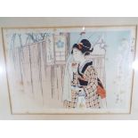 An antique hand signed print of a Japanese lady with stamp marks to the lower middle,