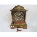 A brass cased French mantel clock,