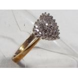 A lady's 9 carat gold 25 pt 1/4 carat diamond cluster ring, size _, approx 3.