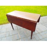 A Victorian mahogany single drawer drop leaf table,