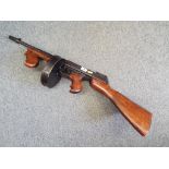 A replica Thompson sub machine gun (.