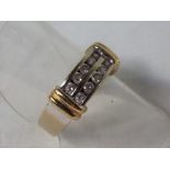 A lady's 14 carat yellow gold ring set with ten x 3 pt diamonds, 30 pts in total, size N + 1/2,
