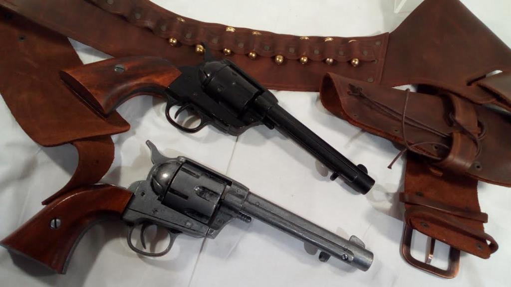 Two replica single action army .