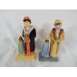 Two figurines depicting Clarice Cliff issued in a limited edition, one marked as a trial piece (2).