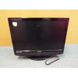 A Technika flat screen TV with built in DVD player. Screen size 21" with remote control.