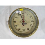 A brass cased ships clock by Smiths Astral, large centre seconds hand in red,
